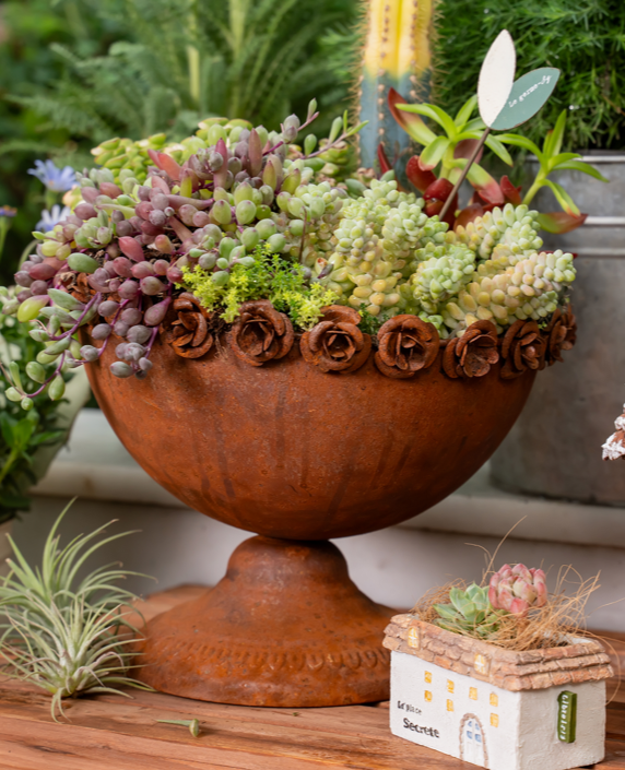 Rust-colored rose trophy shaped iron flowerpot