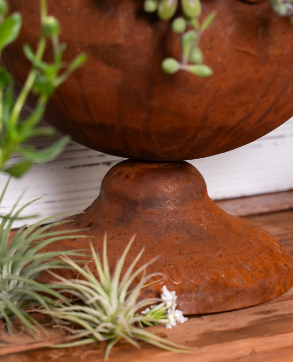 Rust-colored rose trophy shaped iron flowerpot