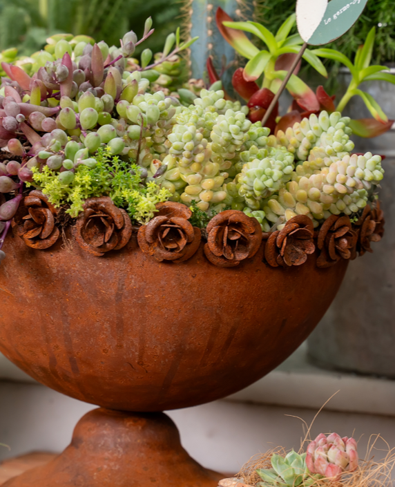 Rust-colored rose trophy shaped iron flowerpot